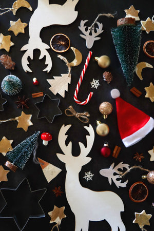 Various Christmas decorations in neutral colors on dark background. Top view.の写真素材