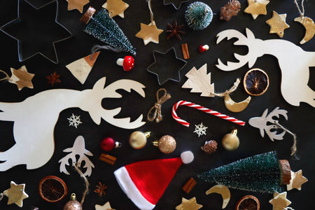 Various Christmas decorations in neutral colors on dark background. Top view.の写真素材