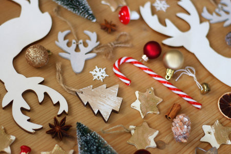 Various Christmas decorations in neutral colors on wooden background. Selective focus.の写真素材