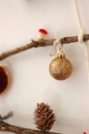 Cute Christmas tree ornaments, hanging on the branches. Selective focus.の写真素材