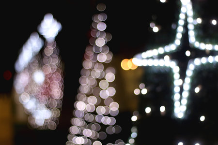 Defocused Christmas lights, lit at night. Defocused holdiay background.の写真素材