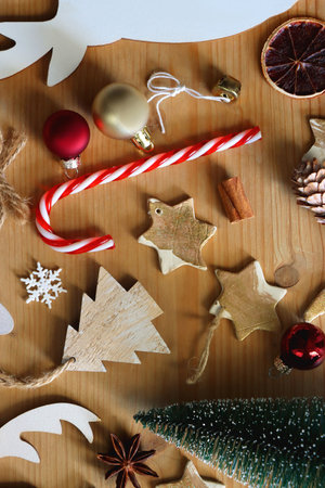 Various Christmas decorations in neutral colors on wooden background. Flat lay.の写真素材