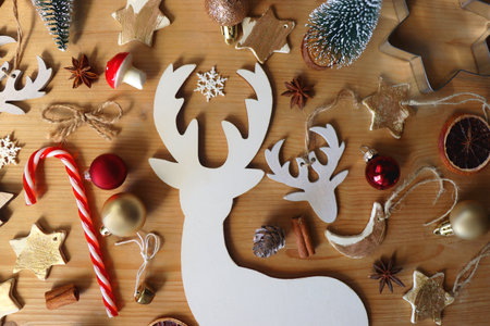 Various Christmas decorations in neutral colors on wooden background. Flat lay.の写真素材