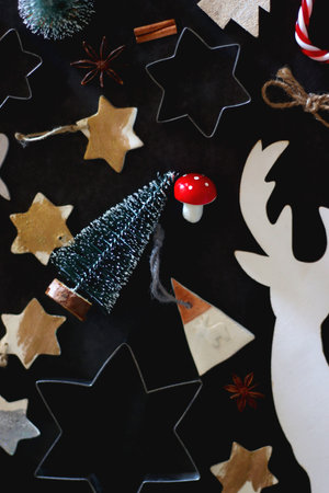 Various Christmas decorations in neutral colors on dark background. Top view.の写真素材
