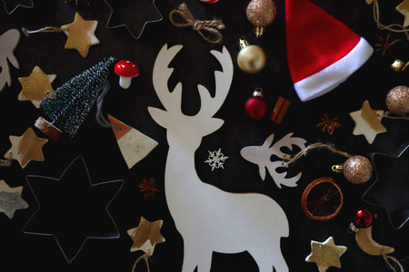Various Christmas decorations in neutral colors on dark background. Top view.の写真素材
