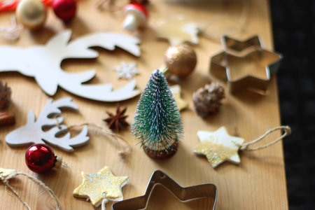 Various Christmas decorations in neutral colors on wooden background. Selective focus.の写真素材