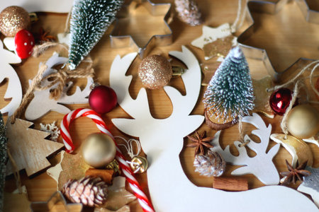 Various Christmas decorations in neutral colors on wooden background. Selective focus.の写真素材