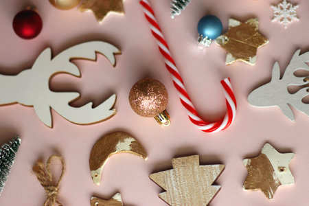 Various cute Christmas ornaments on pale pink background. Selective focus.の写真素材