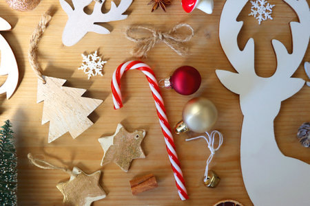 Various Christmas decorations in neutral colors on wooden background. Flat lay.の写真素材