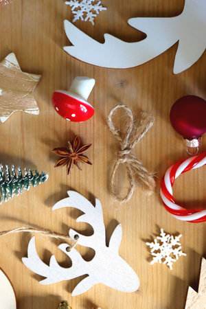 Various Christmas decorations in neutral colors on wooden background. Flat lay.の写真素材