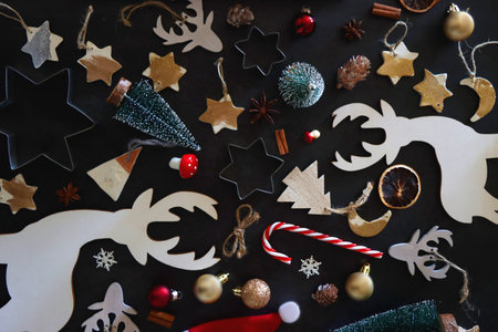 Various Christmas decorations in neutral colors on dark background. Top view.の写真素材