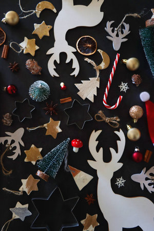 Various Christmas decorations in neutral colors on dark background. Top view.の写真素材