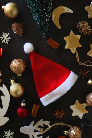 Various Christmas decorations in neutral colors on dark background. Top view.の写真素材