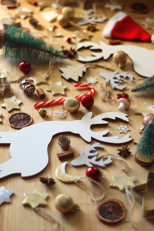 Various Christmas decorations in neutral colors on wooden background. Selective focus.の写真素材