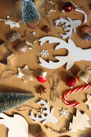 Various Christmas decorations in neutral colors on wooden background. Flat lay.の写真素材