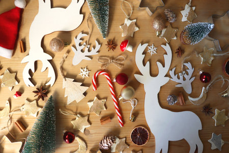 Various Christmas decorations in neutral colors on wooden background. Flat lay.の写真素材