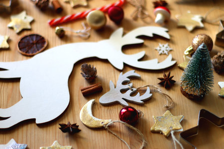 Various Christmas decorations in neutral colors on wooden background. Selective focus.の写真素材