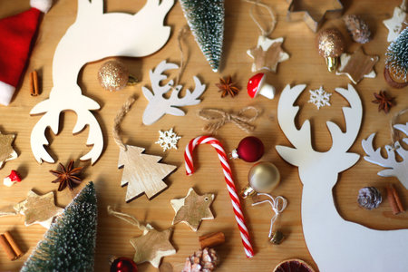 Various Christmas decorations in neutral colors on wooden background. Selective focus.の写真素材