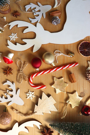 Various Christmas decorations in neutral colors on wooden background. Flat lay.の写真素材