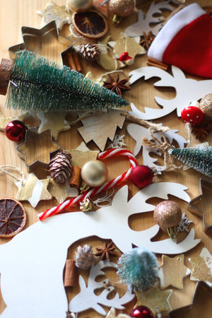 Various Christmas decorations in neutral colors on wooden background. Selective focus.の写真素材