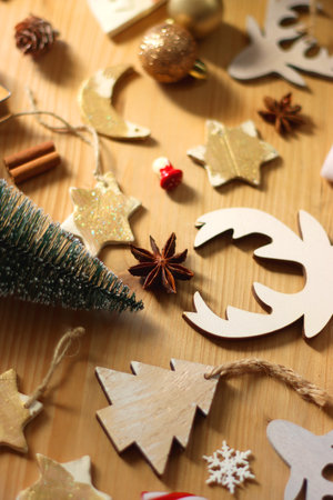 Various Christmas decorations in neutral colors on wooden background. Selective focus.の写真素材