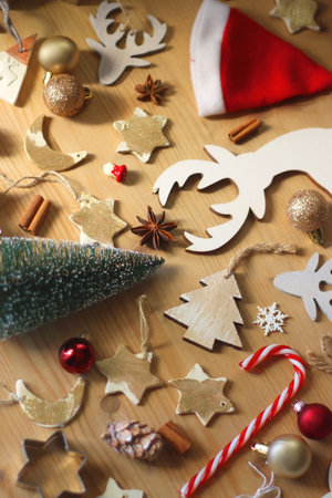 Various Christmas decorations in neutral colors on wooden background. Selective focus.の写真素材