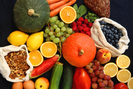 Various healthy fruits, vegetables and cereals on dark background. Top view.の写真素材