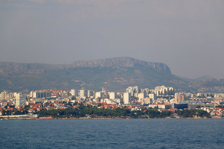 Contemporary buildings, gardens and beaches at the waterfront in Split, Croatia. View of Split from the boat.の写真素材
