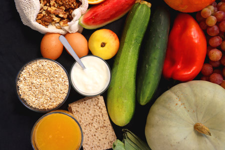 Various healthy fruits, vegetables and cereals on dark background. Top view.の写真素材