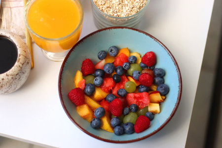 Assortment of various breakfast foods and drinks on the white table. Selective focus.の写真素材