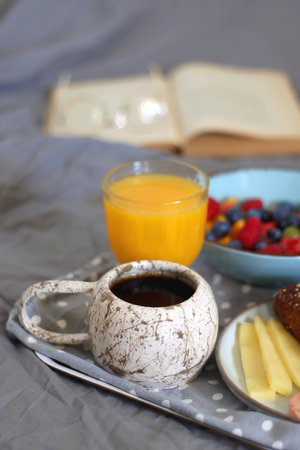 Assortment of various breakfast foods and drinks on the white table. Selective focus.の写真素材