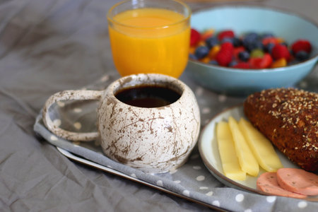 Assortment of various breakfast foods and drinks on the white table. Selective focus.の写真素材