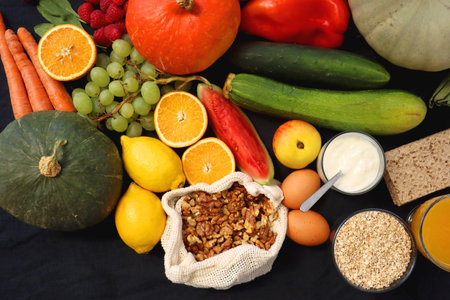 Various healthy fruits, vegetables and cereals on dark background. Top view.の写真素材