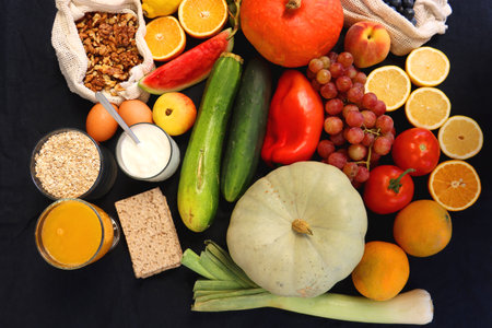 Various healthy fruits, vegetables and cereals on dark background. Top view.の写真素材