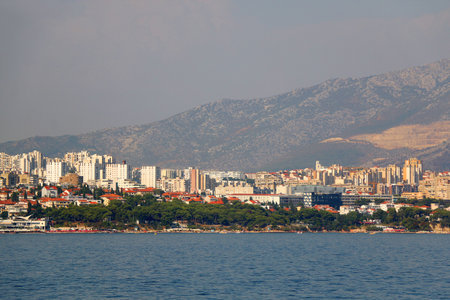 Contemporary buildings, gardens and beaches at the waterfront in Split, Croatia. View of Split from the boat.の写真素材