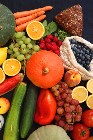 Various healthy fruits, vegetables and cereals on dark background. Top view.の写真素材