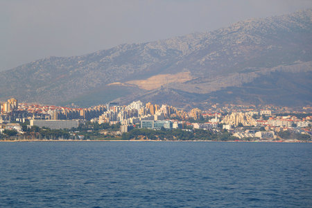 Contemporary buildings, gardens and beaches at the waterfront in Split, Croatia. View of Split from the boat.の写真素材