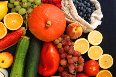 Various healthy fruits, vegetables and cereals on dark background. Top view.の写真素材