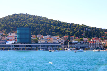 Contemporary buildings, gardens and beaches at the waterfront in Split, Croatia. View of Split from the boat.の写真素材