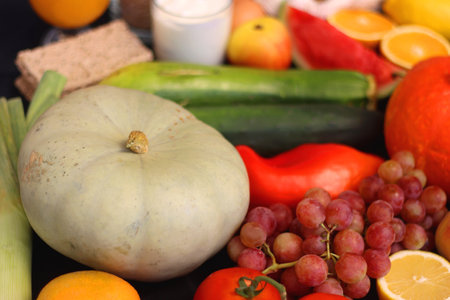 Various healthy fruits, vegetables and cereals on dark background. Selective focus.の写真素材