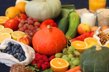 Various healthy fruits, vegetables and cereals on dark background. Selective focus.の写真素材