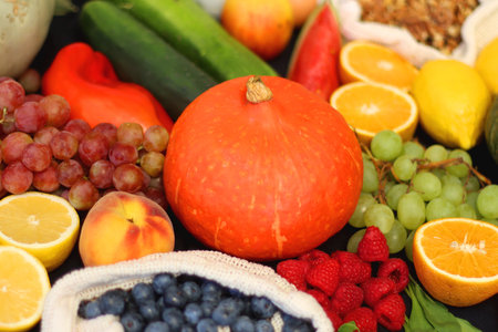 Various healthy fruits, vegetables and cereals on dark background. Selective focus.の写真素材