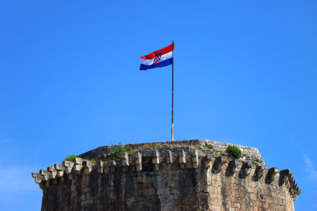 Historical Kamerlengo Fortress in Trogir, Croatia and Croatian flag.の写真素材