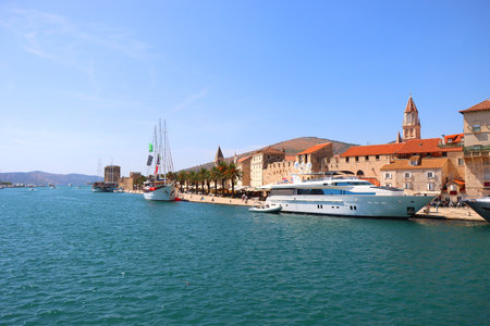 Beautiful old buildings, boats and yachts on the promenade in Trogir, Croatia. Sunny summer day in Trogir.の写真素材