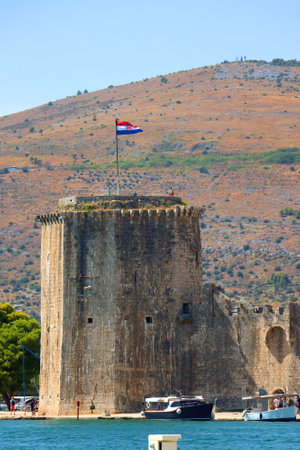 Historical Kamerlengo Fortress in Trogir, Croatia and Croatian flag.の写真素材