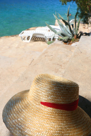 Straw hat on the beach. Selective focus.の写真素材