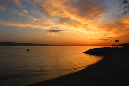 Beautiful sunset on the beach in Omis, Croatia.の写真素材