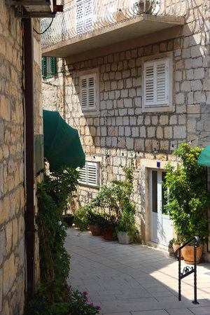 Picturesque Mediterranean street in coastal town Makarska, Croatia. Makarska is popular summer travel destination.の写真素材