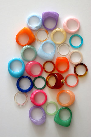 Collection of colorful plastic rings on white background. Top view.の写真素材