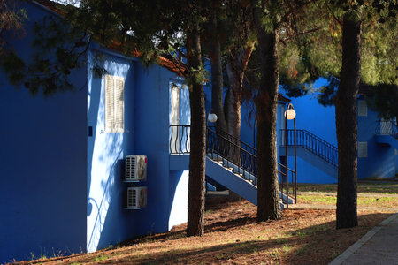 Bright blue Mediterranean house and garden.の写真素材